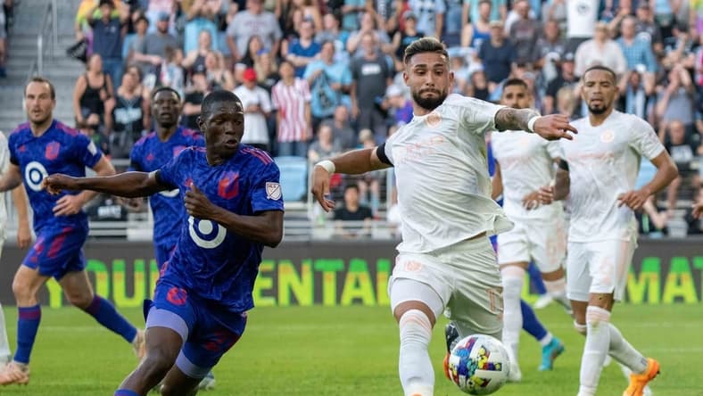 May 28, 2022; Saint Paul, Minnesota, USA; New York City midfielder Valentin Castellanos (11) and Minnesota United forward Bongokuhle Hlongwane (21) chase the ball at Allianz Field. Mandatory Credit: Matt Blewett-USA TODAY Sports