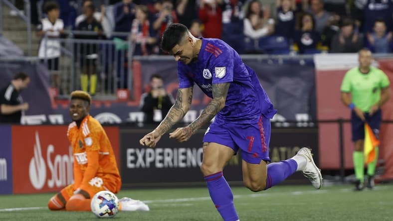 May 28, 2022; Foxborough, Massachusetts, USA; New England Revolution forward Gustavo Bou (7) celebrates his penalty goal against Philadelphia Union goalkeeper Andre Blake (18) during the second half at Gillette Stadium. Mandatory Credit: Winslow Townson-USA TODAY Sports