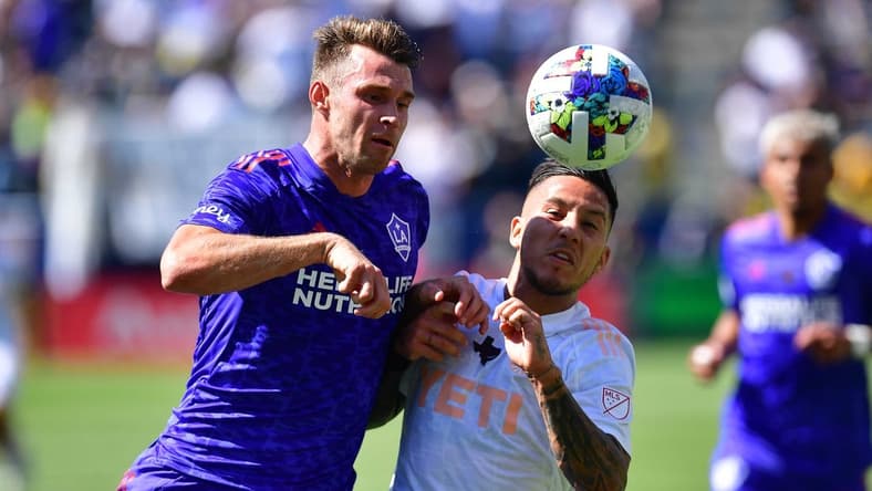 May 29, 2022; Carson, California, USA; Austin FC forward Sebastian Driussi (7) plays for the ball against Los Angeles Galaxy forward Nick DePuy (20)  during the first half at Dignity Health Sports Park. Mandatory Credit: Gary A. Vasquez-USA TODAY Sports