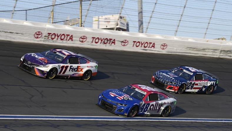 May 29, 2022; Concord, North Carolina, USA; NASCAR Cup Series driver Denny Hamlin (11) races NASCAR Cup Series driver Alex Bowman (48) and NASCAR Cup Series driver William Byron (24) during the Coca-Cola 600 at Charlotte Motor Speedway. Mandatory Credit: Jasen Vinlove-USA TODAY Sports