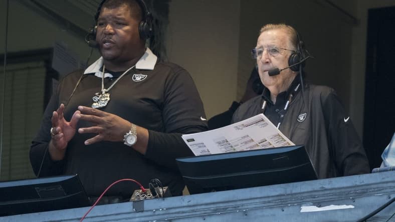 August 24, 2018; Oakland, CA, USA; Oakland Raiders broadcasters Lincoln Kennedy (left) and Brent Musburger (right) before the game against the Green Bay Packers at Oakland Coliseum. Mandatory Credit: Kyle Terada-USA TODAY Sports