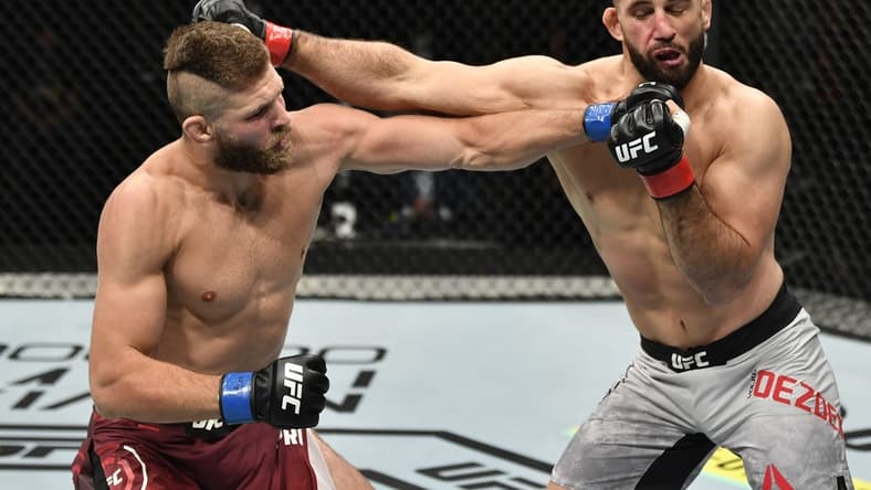July 12, 2020; Abu Dhabi, UAE;  Jiri Prochazka of the Czech Republic punches Volkan Oezdemir of Switzerland in their light heavyweight fight during the UFC 251 event at Flash Forum on UFC Fight Island on July 12, 2020 on Yas Island, Abu Dhabi, United Arab Emirates. Mandatory Credit: Jeff Bottari/Zuffa LLC via USA TODAY Sports