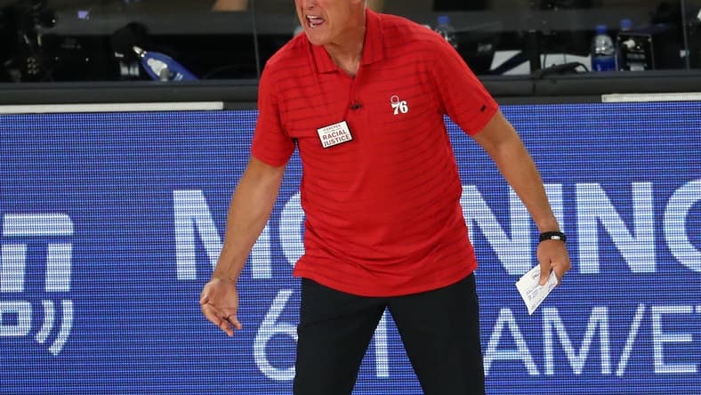Aug 23, 2020; Lake Buena Vista, Florida, USA; Philadelphia 76ers head coach Brett Brown reacts after receiving a technical foul against the Boston Celtics during the third quarter in game four of an NBA basketball first-round playoff series at The Field House. Mandatory Credit: Kim Klement-USA TODAY Sports