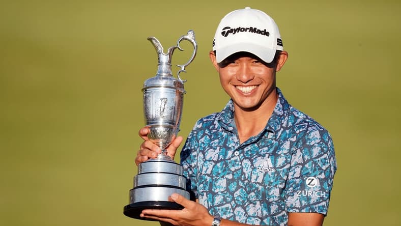 Jul 18, 2021; Sandwich, England, GBR; Collin Morikawa celebrates with the Claret Jug on the 18th green following his final round winning the Open Championship golf tournament. Mandatory Credit: Peter van den Berg-USA TODAY Sports