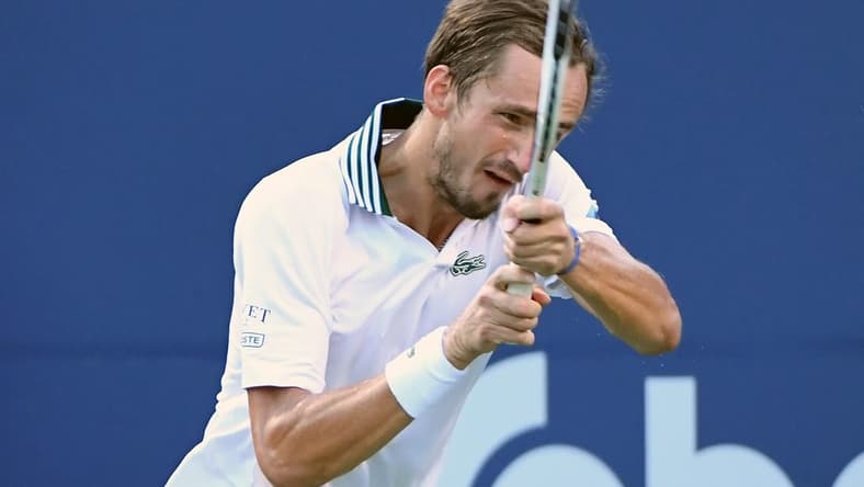 Aug 12, 2021; Toronto, Ontario, Canada;  Daniil Medvedev of Russia plays a shot against James Duckworth of Australia during fourth round play in the National Bank Open at Aviva Centre. Mandatory Credit: Dan Hamilton-USA TODAY Sports