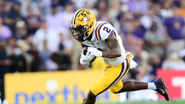 Sep 4, 2021; Pasadena, California, USA; Louisiana State Tigers wide receiver Koy Moore (2) runs the ball against the UCLA Bruins during the first half the at the Rose Bowl. Mandatory Credit: Gary A. Vasquez-USA TODAY Sports