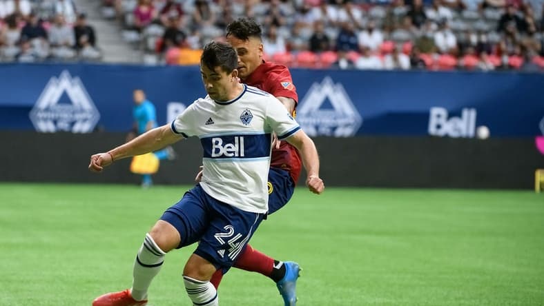 Aug 29, 2021; Vancouver, British Columbia, CAN;  Vancouver Whitecaps FC forward Brian White (24) controls the ball against Real Salt Lake defender Marcelo Silva (30) during the first half at BC Place. Mandatory Credit: Anne-Marie Sorvin-USA TODAY Sports