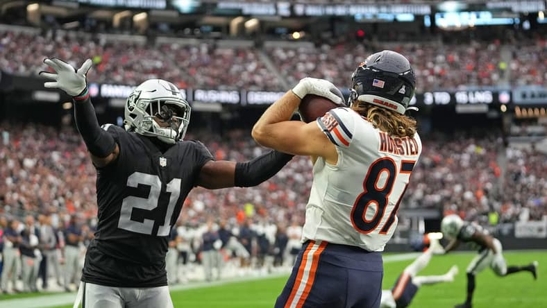 Oct 10, 2021; Paradise, Nevada, USA; Chicago Bears tight end Jesper Horsted (87) makes a touchdown catch as Las Vegas Raiders cornerback Amik Robertson (21) defends the play during a game at Allegiant Stadium. Mandatory Credit: Stephen R. Sylvanie-USA TODAY Sports