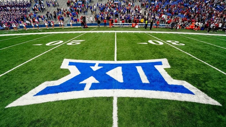 Oct 23, 2021; Lawrence, Kansas, USA; A general view of the Big 12 Conference logo on the field after the game between the Kansas Jayhawks and the Oklahoma Sooners at David Booth Kansas Memorial Stadium. Mandatory Credit: Jay Biggerstaff-USA TODAY Sports