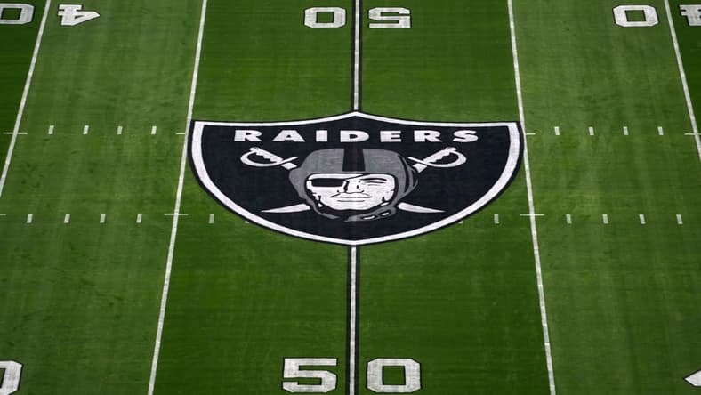 Nov 14, 2021; Paradise, Nevada, USA; A detailed view of the Las Vegas Raiders shield logo at midfield at Allegiant Stadium. Mandatory Credit: Kirby Lee-USA TODAY Sports