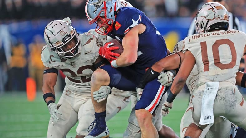Dec 11, 2021; East Rutherford, New Jersey, USA; Navy Midshipmen fullback Isaac Ruoss (32) carries the ball against the Army Black Knights during the second half of the 122nd Army-Navy game. Mandatory Credit: Danny Wild-USA TODAY Sports