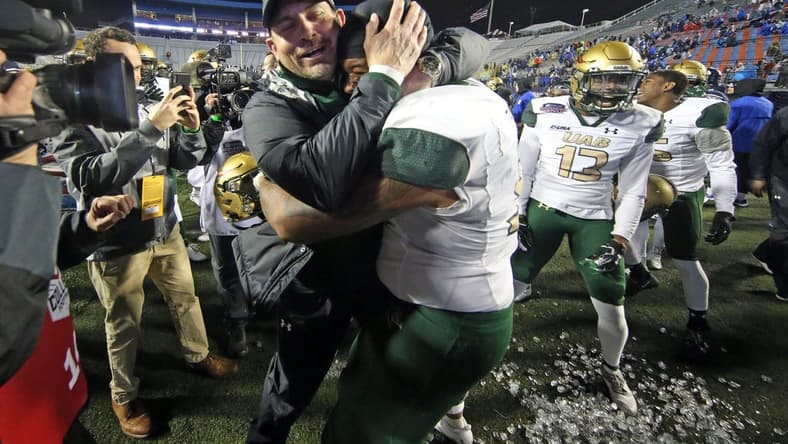 Dec 18, 2021; Shreveport, LA, USA; UAB Blazers head coach Bill Clark embraces  UAB Blazers offensive linemen Colby Ragland (53) after defeating the BYU Cougars during the 2021 Independence Bowl at Independence Stadium. Mandatory Credit: Petre Thomas-USA TODAY Sports