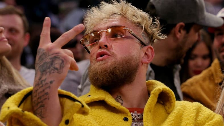 Feb 2, 2022; New York, New York, USA; American boxer Jake Paul gestures at a fan during the third quarter between the New York Knicks and the Memphis Grizzlies at Madison Square Garden. Mandatory Credit: Brad Penner-USA TODAY Sports