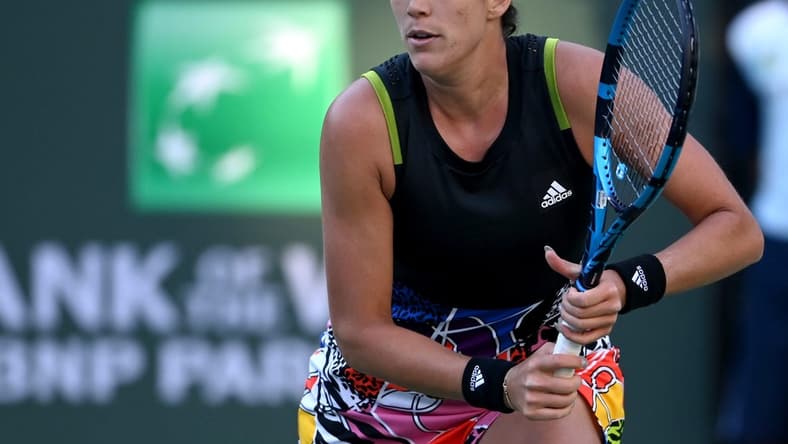 Mar 11, 2022; Indian Wells, CA, USA; Garbine Muguruza (ESP) hits a shot against Alison Riske (USA) in her 2nd round match at the BNP Paribas Open at the Indian Wells Tennis Garden. Mandatory Credit: Jayne Kamin-Oncea-USA TODAY Sports