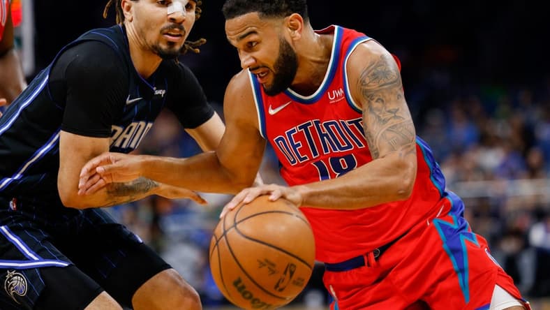 Mar 17, 2022; Orlando, Florida, USA;  Detroit Pistons guard Cory Joseph (18) drives to the basket past Orlando Magic guard Cole Anthony (50) in the first quarter at Amway Center. Mandatory Credit: Nathan Ray Seebeck-USA TODAY Sports