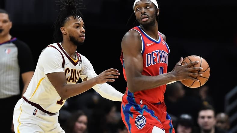 Mar 19, 2022; Cleveland, Ohio, USA; Cleveland Cavaliers guard Darius Garland (10) defends Detroit Pistons forward Jerami Grant (9) during the second half at Rocket Mortgage FieldHouse. Mandatory Credit: Ken Blaze-USA TODAY Sports