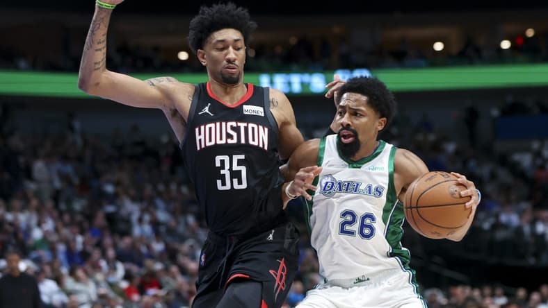 Mar 23, 2022; Dallas, Texas, USA;  Dallas Mavericks guard Spencer Dinwiddie (26) drives to the basket as Houston Rockets center Christian Wood (35) defends during the first quarter at American Airlines Center. Mandatory Credit: Kevin Jairaj-USA TODAY Sports