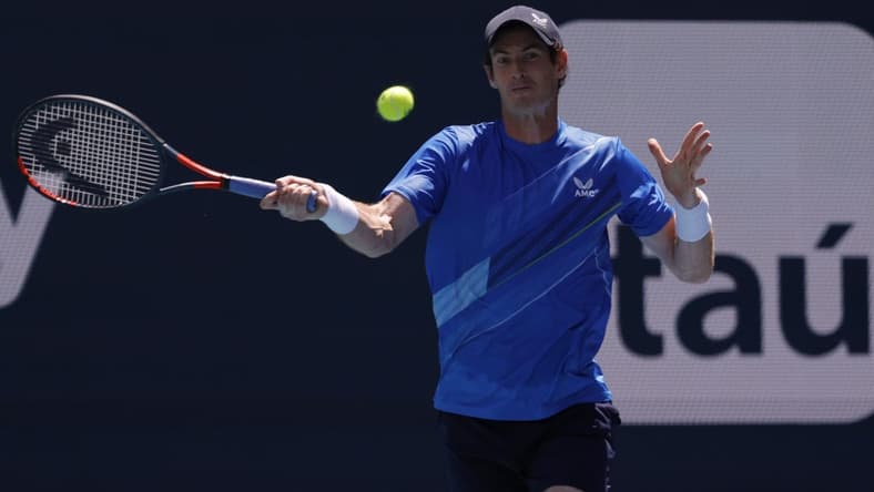 Mar 26, 2022; Miami Gardens, FL, USA; Andy Murray (GBR) hits a forehand against Daniil Medvedev (not pictured) in a second round men's singles match in the Miami Open at Hard Rock Stadium. Mandatory Credit: Geoff Burke-USA TODAY Sports
