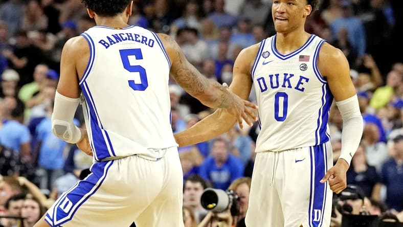 Apr 2, 2022; New Orleans, LA, USA; Duke Blue Devils forward Paolo Banchero (5) and forward Wendell Moore Jr. (0) celebrates after a play during the second half against the North Carolina Tar Heels in the 2022 NCAA men's basketball tournament Final Four semifinals at Caesars Superdome. Mandatory Credit: Robert Deutsch-USA TODAY Sports