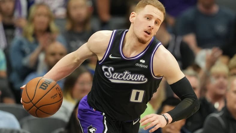 Apr 3, 2022; Sacramento, California, USA; Sacramento Kings guard Donte DiVincenzo (0) dribbles during the fourth quarter against the Golden State Warriors at Golden 1 Center. Mandatory Credit: Darren Yamashita-USA TODAY Sports