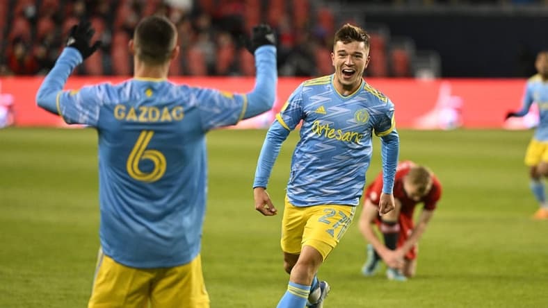 Apr 16, 2022; Toronto, Ontario, CAN;  Philadelphia Union defender Kai Wagner (27) celebrates with midfielder Daniel Gazdag (6) after scoring a goal against Toronto FC in the first half at BMO Field. Mandatory Credit: Dan Hamilton-USA TODAY Sports