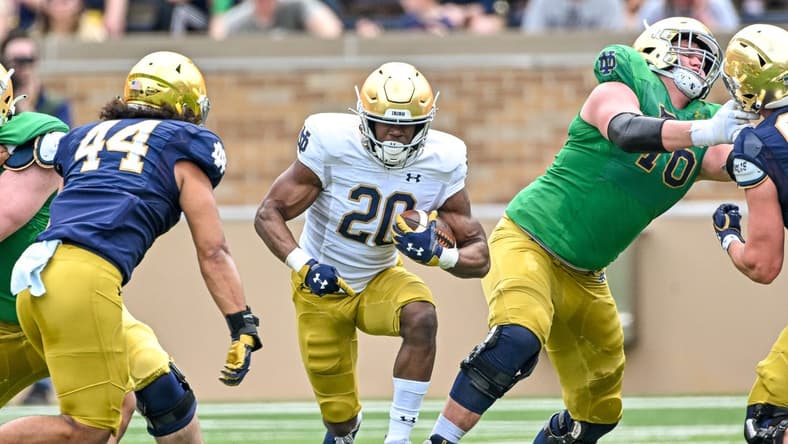 Apr 23, 2022; Notre Dame, Indiana, USA; Notre Dame Fighting Irish running back Jadarian Price (20) carries in the first quarter of the Blue-Gold Game at Notre Dame Stadium. Mandatory Credit: Matt Cashore-USA TODAY Sports