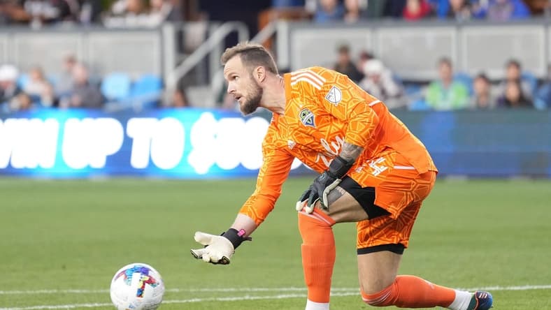 Apr 23, 2022; San Jose, California, USA; Seattle Sounders goalkeeper Stefan Frei (24) passes during the first half against the San Jose Earthquakes at PayPal Park. Mandatory Credit: Darren Yamashita-USA TODAY Sports