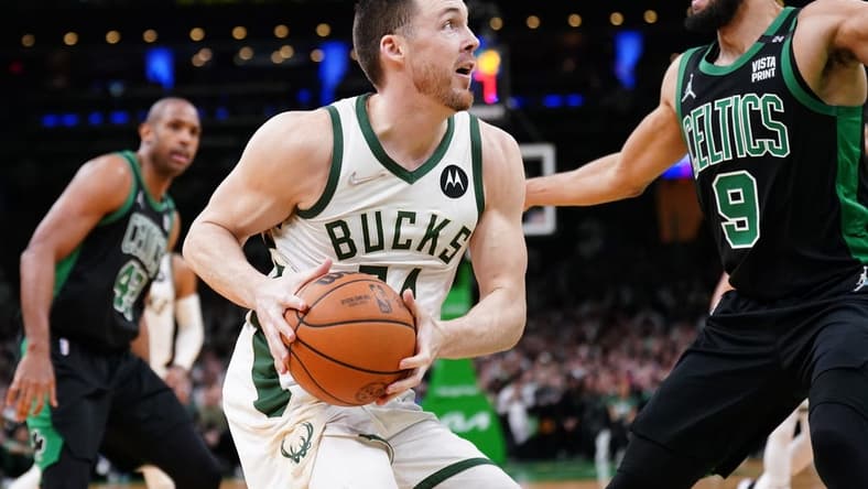 May 1, 2022; Boston, Massachusetts, USA; Milwaukee Bucks guard Pat Connaughton (24) drives the ball against Boston Celtics guard Derrick White (9) in the second half during game one of the second round for the 2022 NBA playoffs at TD Garden. Mandatory Credit: David Butler II-USA TODAY Sports