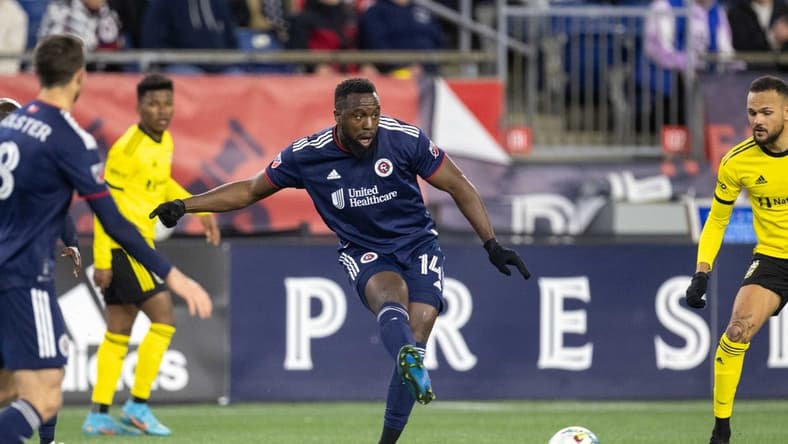 May 7, 2022; Foxborough, Massachusetts, USA; New England Revolution forward Jozy Altidore (14) passes the ball during the second half against the Columbus Crew at Gillette Stadium. Mandatory Credit: Paul Rutherford-USA TODAY Sports