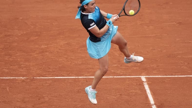 May 22, 2022; Paris, France;  Ons Jabeur (TUN) returns the ball during her match against Magda Linette (POL) on day one of the French Open at Stade Roland-Garros. Mandatory Credit: Susan Mullane-USA TODAY Sports