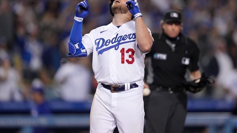 May 4, 2022; Los Angeles, California, USA; Los Angeles Dodgers third baseman Max Muncy (13) celebrates after hitting a two-run home run in the eighth inning against the San Francisco Giants at Dodger Stadium. Mandatory Credit: Kirby Lee-USA TODAY Sports