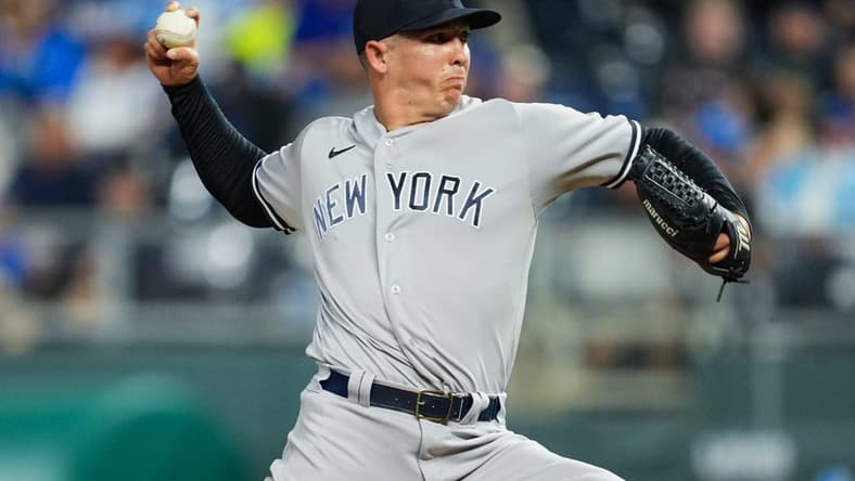 Apr 29, 2022; Kansas City, Missouri, USA; New York Yankees relief pitcher Chad Green (57) pitches against the Kansas City Royals during the seventh inning at Kauffman Stadium. Mandatory Credit: Jay Biggerstaff-USA TODAY Sports