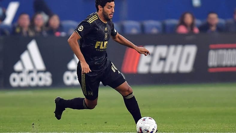 May 25, 2022; Carson, California, USA; Los Angeles FC forward Carlos Vela (10) moves the ball against Los Angeles Galaxy during the first half at Dignity Health Sports Park. Mandatory Credit: Gary A. Vasquez-USA TODAY Sports