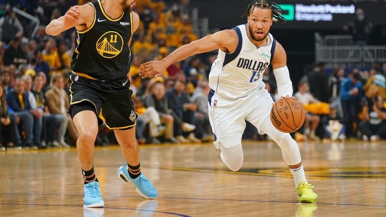 May 26, 2022; San Francisco, California, USA; Dallas Mavericks guard Jalen Brunson (13) dribbles the ball against Golden State Warriors guard Klay Thompson (11) during the first half during game five of the 2022 western conference finals at Chase Center. Mandatory Credit: Cary Edmondson-USA TODAY Sports