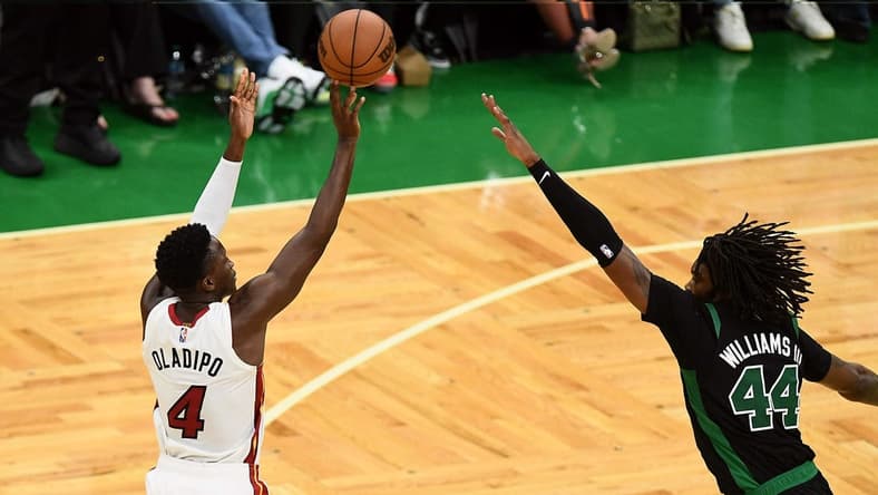 May 27, 2022; Boston, Massachusetts, USA; Miami Heat guard Victor Oladipo (4) shoots against Boston Celtics center Robert Williams III (44) during the second half in game six of the 2022 eastern conference finals at TD Garden. Mandatory Credit: Brian Fluharty-USA TODAY Sports