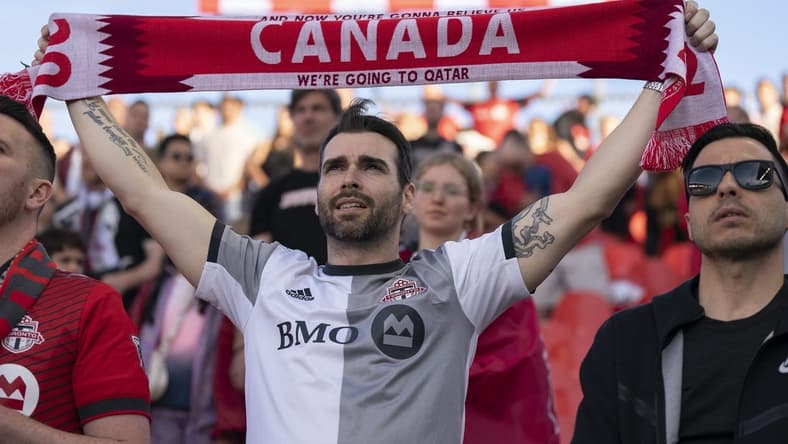 May 28, 2022; Toronto, Ontario, CAN; Toronto FC fans show their support during the national anthem before a match against the Chicago Fire at BMO Field. Mandatory Credit: Nick Turchiaro-USA TODAY Sports