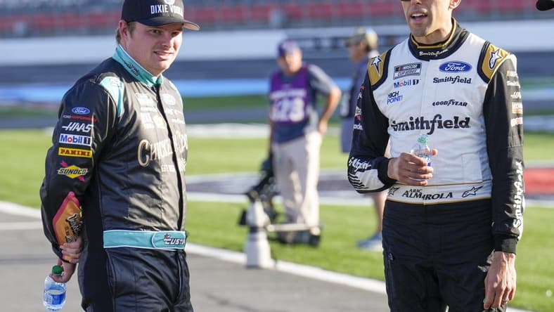 May 28, 2022; Concord, North Carolina, USA; NASCAR Cup Series driver Aric Almirola (10) and driver Cole Custer (41) talk during Nascar Cup Practice at Charlotte Motor Speedway. Mandatory Credit: Jim Dedmon-USA TODAY Sports