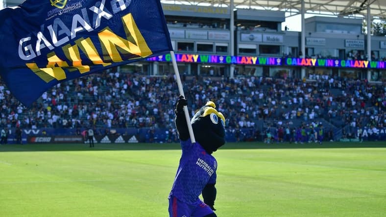 May 29, 2022; Carson, California, USA; Los Angeles Galaxy mascot Cozmo celebrates the victory against Austin FC at Dignity Health Sports Park. Mandatory Credit: Gary A. Vasquez-USA TODAY Sports