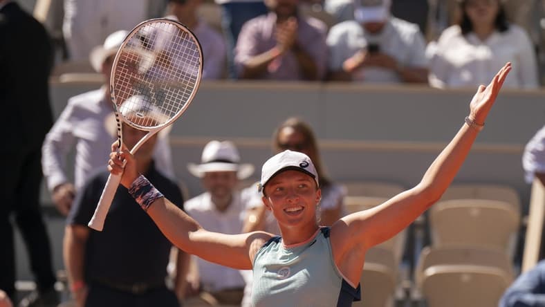 June 2, 2022; Paris, France; Iga Swiatek (POL) celebrates winning her semifinal match against Daria Kasatkina on day 12 of the French Open at Stade Roland-Garros. Mandatory Credit: Susan Mullane-USA TODAY Sports