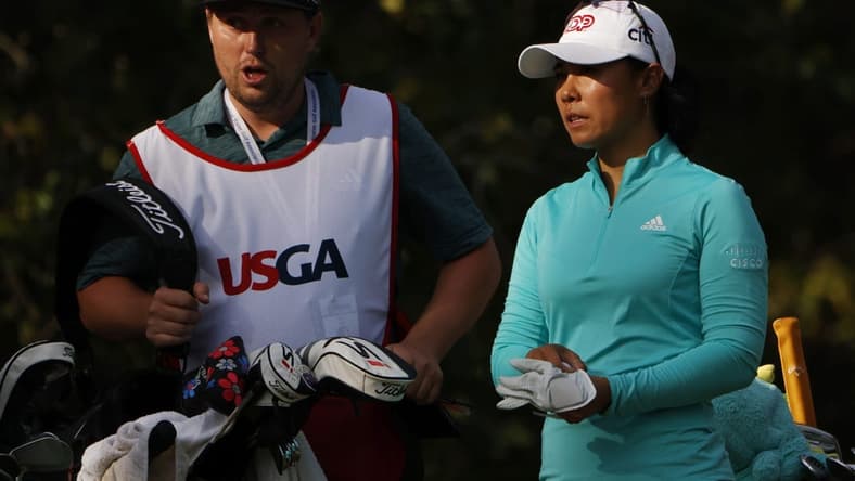 Jun 2, 2022; Southern Pines, North Carolina, USA; Danielle Kang (R) talks with her caddie (L) prior to hitting her tee shot on the twelfth hole during the first round of the U.S. Women's Open. Mandatory Credit: Geoff Burke-USA TODAY Sports