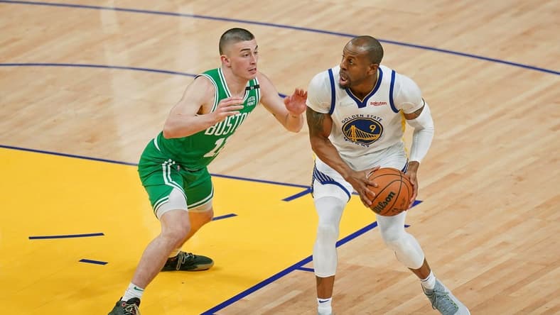 Jun 2, 2022; San Francisco, California, USA; Golden State Warriors forward Andre Iguodala (9) controls the ball while defended by Boston Celtics guard Payton Pritchard (11) during the second half of game one of the 2022 NBA Finals at Chase Center. Mandatory Credit: Cary Edmondson-USA TODAY Sports
