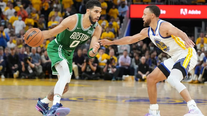 Jun 2, 2022; San Francisco, California, USA; Boston Celtics forward Jayson Tatum (0) dribbles the ball while defended by Golden State Warriors guard Stephen Curry (30) during the second half in game one of the 2022 NBA Finals at Chase Center. Mandatory Credit: Kyle Terada-USA TODAY Sports