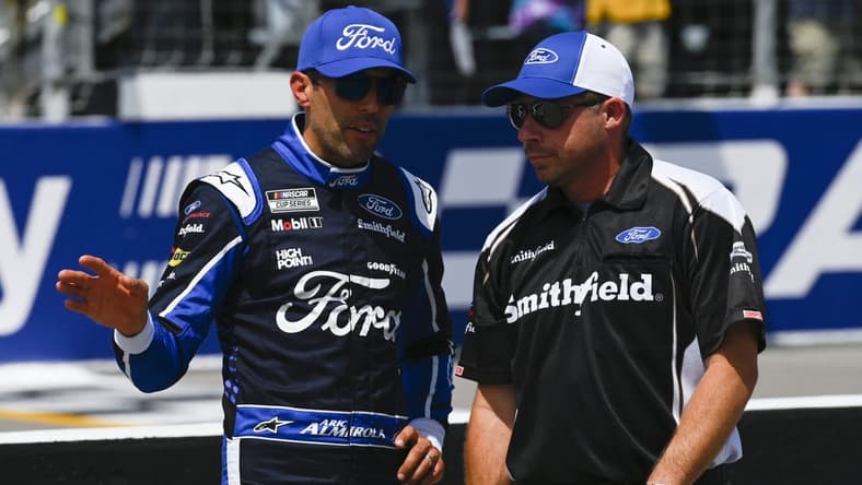 Jun 4, 2022; Madison, Illinois, USA; NASCAR Cup Series driver Chase Briscoe (14) speaks with a crew member during Nascar Cup qualifying at World Wide Technology Raceway at Gateway. Mandatory Credit: Joe Puetz-USA TODAY Sports