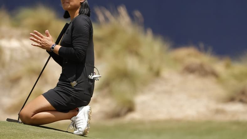 Jun 4, 2022; Southern Pines, North Carolina, USA; Danielle Kang claps on the eighteenth green for Lizette Salas (not pictured) on the first tee during the third round of the U.S. Women's Open. Mandatory Credit: Geoff Burke-USA TODAY Sports