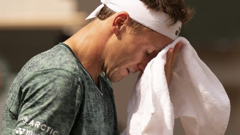 June 5, 2022; Paris, France; Casper Ruud (NOR) takes a towel break during the men s singles final against Rafael Nadal (ESP) on day 15 of the French Open at Stade Roland-Garros. Mandatory Credit: Susan Mullane-USA TODAY Sports