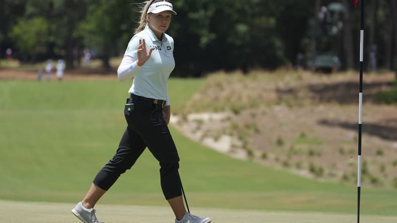 Jun 5, 2022; Southern Pines, North Carolina, USA; Brooke Henderson acknowledges the fans after a putt on the first green during the final round of the U.S. Women's Open. Mandatory Credit: David Yeazell-USA TODAY Sports
