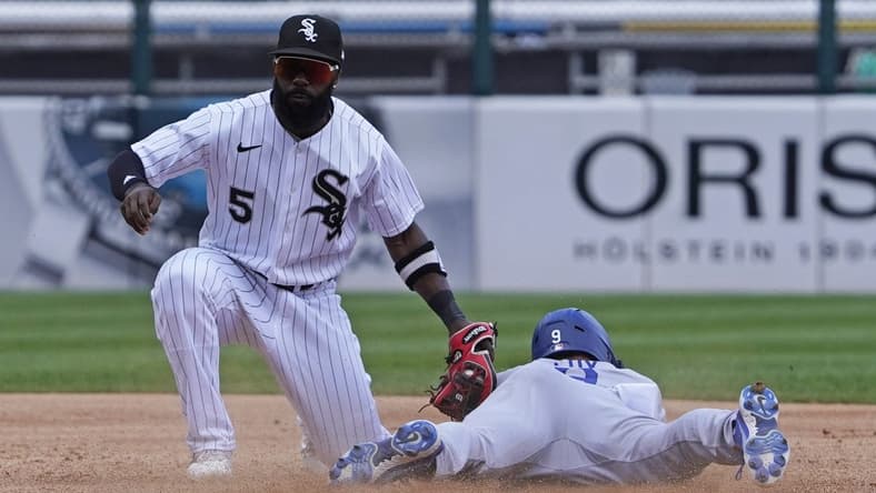 Jun 9, 2022; Chicago, Illinois, USA; Los Angeles Dodgers left fielder Gavin Lux (9) is tagged out at second base on a steal attempt by Chicago White Sox second baseman Josh Harrison (5) during the third inning  at Guaranteed Rate Field. Mandatory Credit: David Banks-USA TODAY Sports