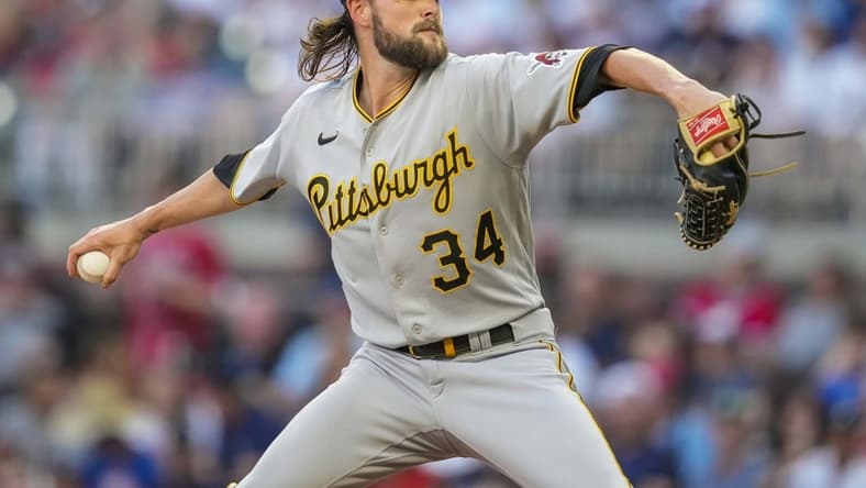Jun 9, 2022; Cumberland, Georgia, USA; Pittsburgh Pirates starting pitcher JT Brubaker (34) pitches against the Atlanta Braves during the second inning at Truist Park. Mandatory Credit: Dale Zanine-USA TODAY Sports