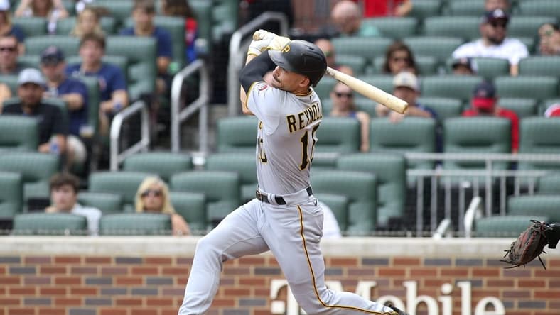 Jun 11, 2022; Atlanta, Georgia, USA; Pittsburgh Pirates center fielder Bryan Reynolds (10) hits a home run against the Atlanta Braves in the first inning at Truist Park. Mandatory Credit: Brett Davis-USA TODAY Sports