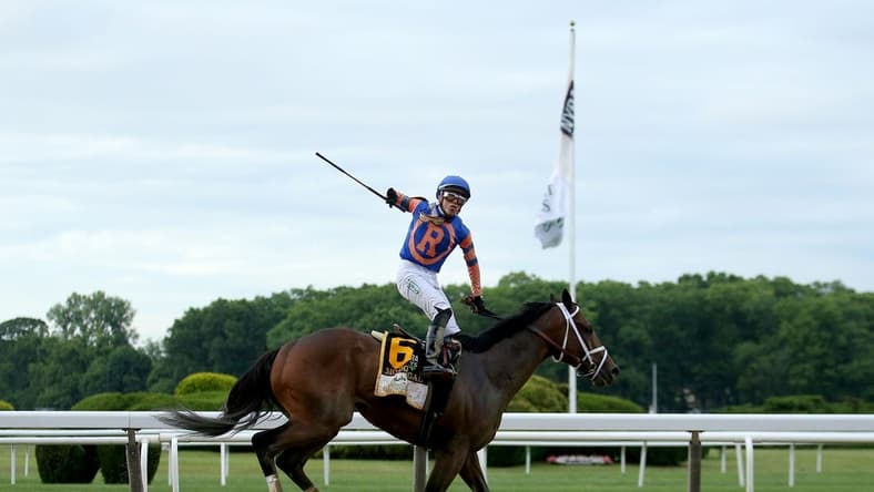 Jun 11, 2022; Elmont, NY, USA; Irad Ortiz, Jr. reacts after winning the Belmont Stakes atop Mo Donegal (6) in the Belmont Stakes, the eleventh race at Belmont Park Racetrack. Mandatory Credit: Brad Penner-USA TODAY Sports